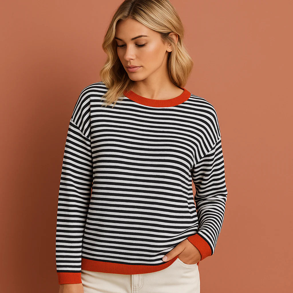 Women’s striped jumper in black and white with elegant design, soft and comfortable for casual and stylish outfits.