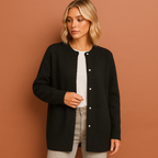 Women’s oversized cardigan in black with minimalist design, soft and comfortable for casual and stylish outfits.