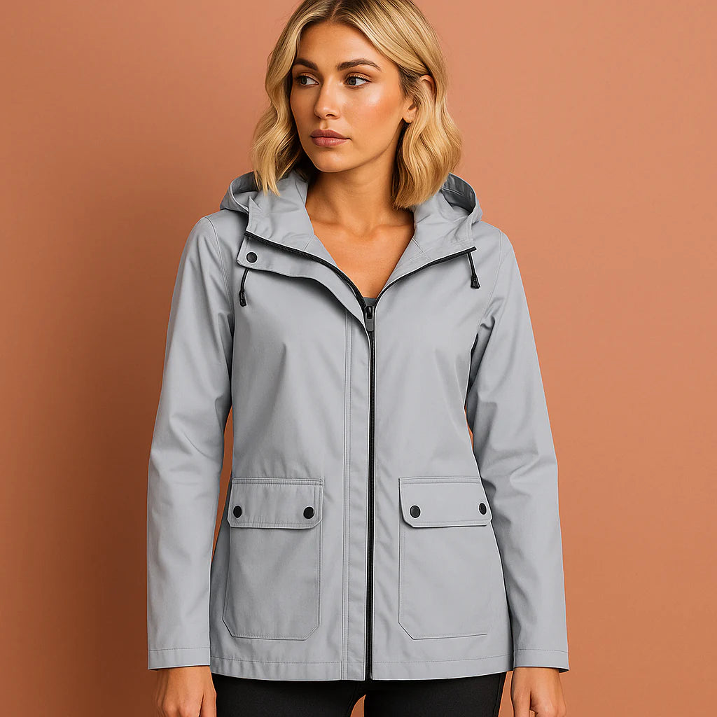 Women’s waterproof jacket in gray with adjustable hood, soft and comfortable for casual and stylish outfits.