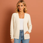 Women’s knitted cardigan in ivory white with round neckline, soft and comfortable for casual and stylish outfits.