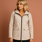 Women’s waterproof jacket in ivory white with adjustable hood, soft and comfortable for casual and stylish outfits.