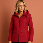 Women’s waterproof jacket in red with adjustable hood, soft and comfortable for casual and stylish outfits.