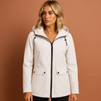 Women’s waterproof jacket in white with adjustable hood, soft and comfortable for casual and stylish outfits.